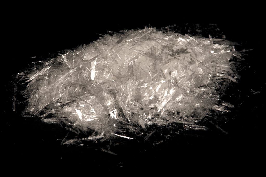 Pile of benzoic acid crystals